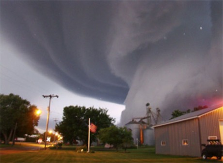 04 p.m. The Globe Gazette and Mitchell County Press News reported that Lori Mehmen of Orchard, took the photo from outside her front door. Mehmen said the funnel cloud came near the ground and then went back up into the clouds. Besides tree and crop damage, no human injuries were reported. (AP Photo/Lori Mehmen)